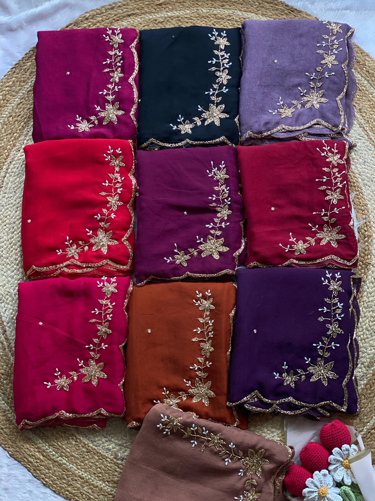 Crush silk saree with gold bead handwork folded in all 10 colours: magenta, black, mauve, red, plum, maroon, rani pink, rust, purple and chocolate brown