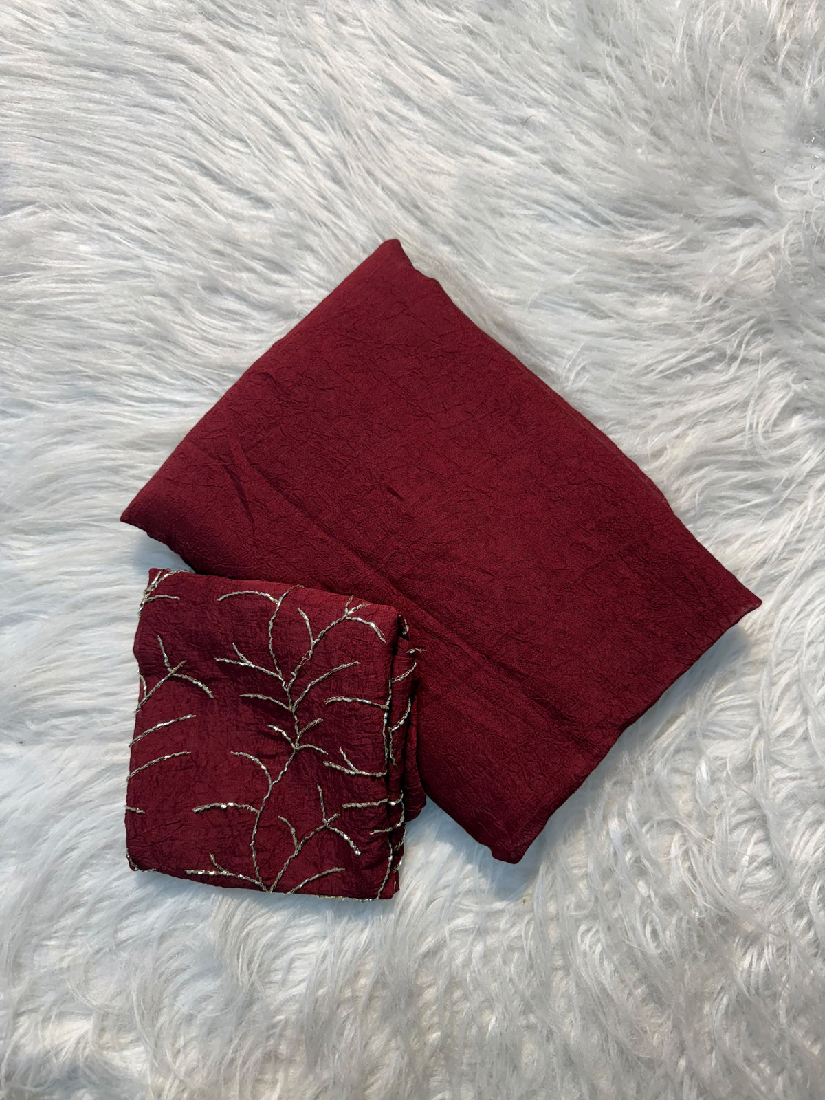 Maroon plain Rangoli viscose georgette saree with embroidered blouse featuring metallic branch motif