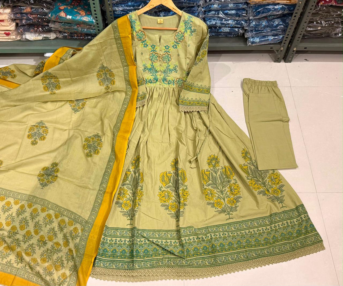 Pista green cotton Anarkali kurta with thread-embroidered yoke and floral print, matching elastic-waist pant and printed mul mul dupatta with mustard border
