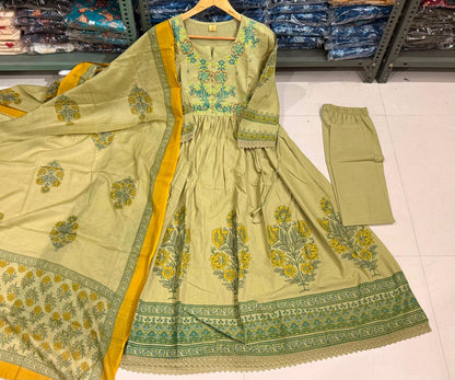 Pista green cotton Anarkali kurta with thread-embroidered yoke and floral print, matching elastic-waist pant and printed mul mul dupatta with mustard border