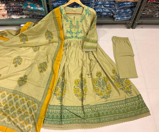 Pista green cotton Anarkali kurta with thread-embroidered yoke and floral print, matching elastic-waist pant and printed mul mul dupatta with mustard border