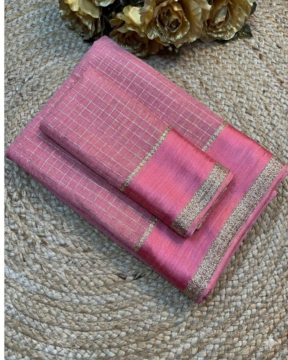 Pink saree with a subtle pattern on a textured surface