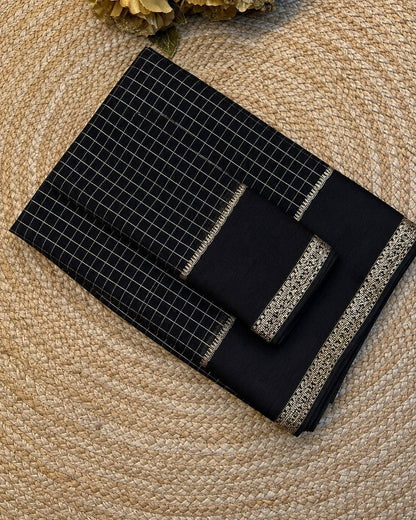 Black grid-patterned set on a textured beige surface