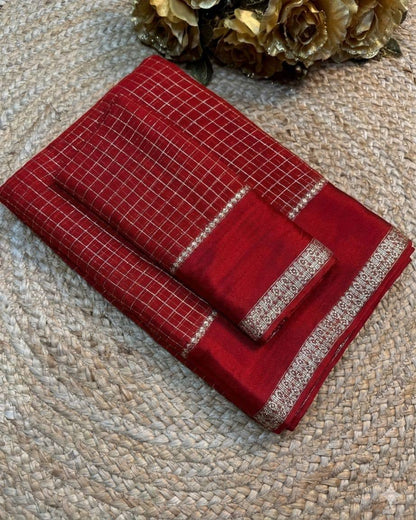 Red checkered on a textured surface with flowers in the background