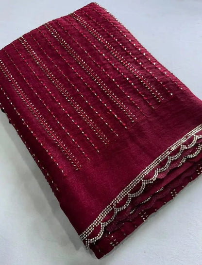A folded deep maroon fabric piece with vertical rows of metallic silver beadwork and a scalloped beaded border, displayed on a light gray background.