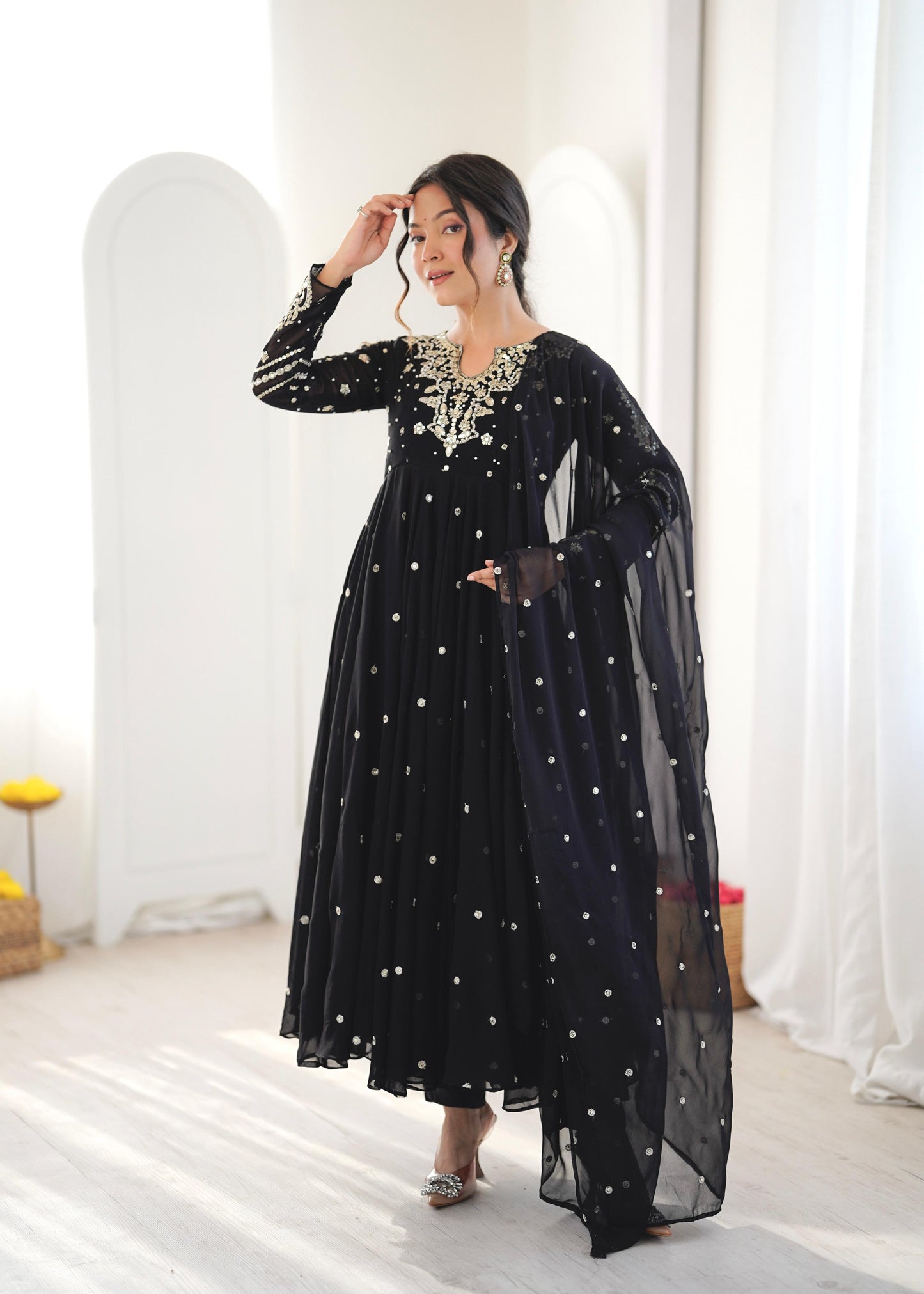 Model in black sequin embroidered Anarkali gown with dupatta, close-up pose