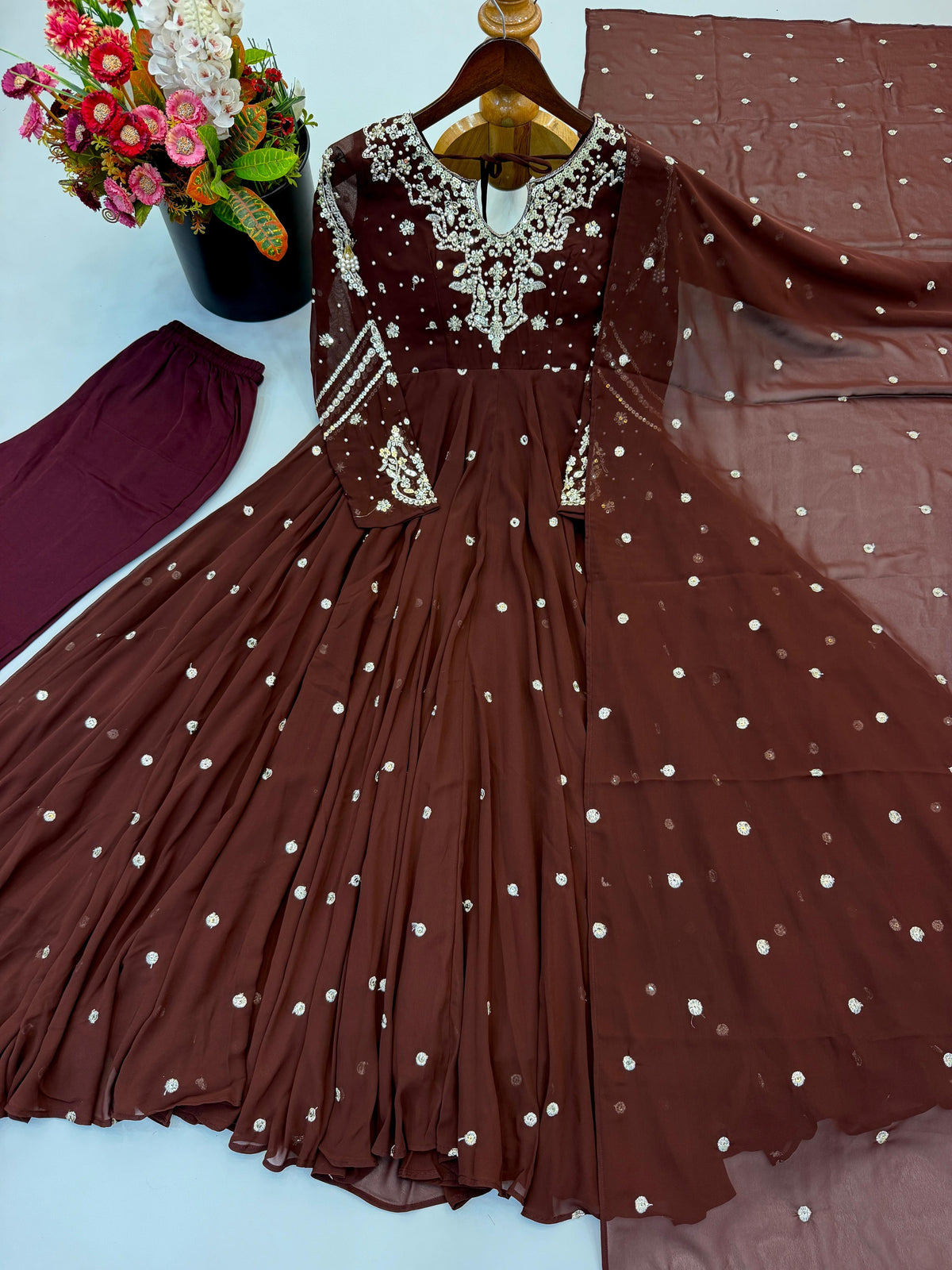 Brown sequin embroidered Anarkali gown, pants and dupatta set laid flat