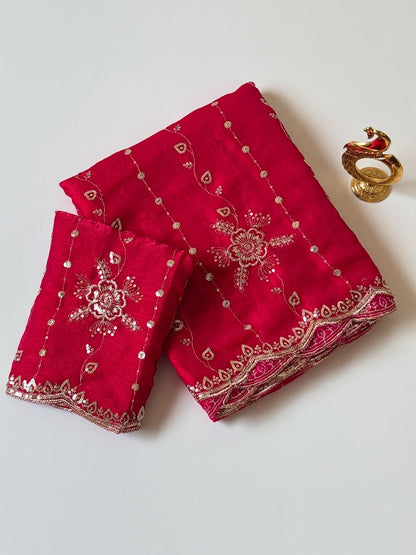 Rani pink Fendy chiffon saree with gold sequin embroidery and scalloped border, folded with blouse piece
