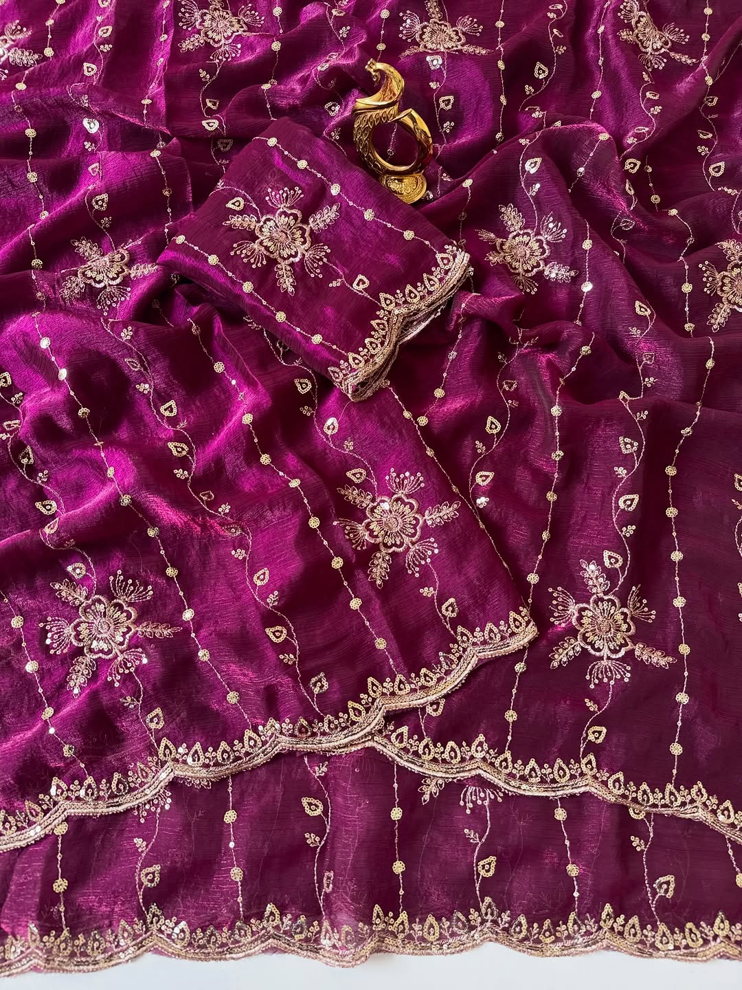Wine Fendy chiffon saree spread out showing all-over floral sequin embroidery