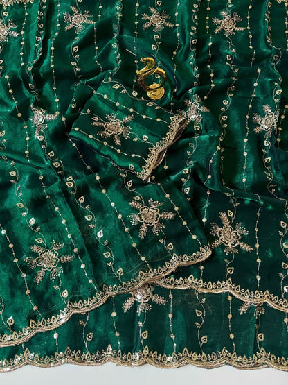 Bottle green Fendy chiffon saree spread out showing all-over floral sequin embroidery