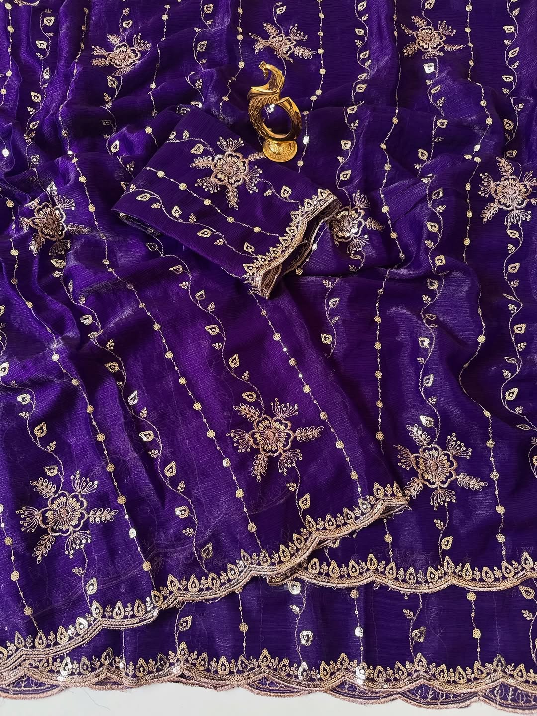 Purple Fendy chiffon saree spread out showing all-over floral sequin embroidery