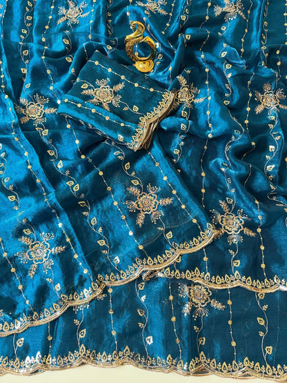 Peacock blue Fendy chiffon saree spread out showing all-over floral sequin embroidery