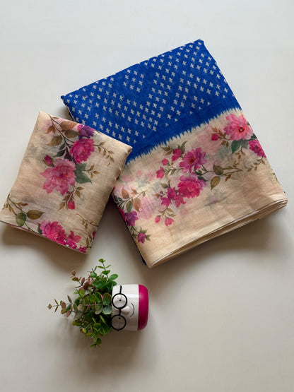 Royal blue linen cotton saree with white cross-motif print and floral digital print border, folded with printed blouse piece