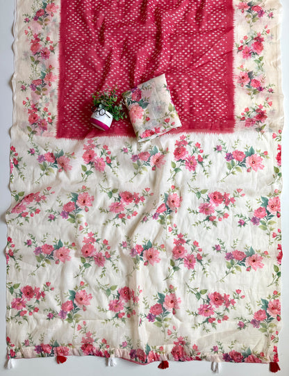 Red linen cotton saree spread out showing cream floral pallu with mirror work and red and white tassels