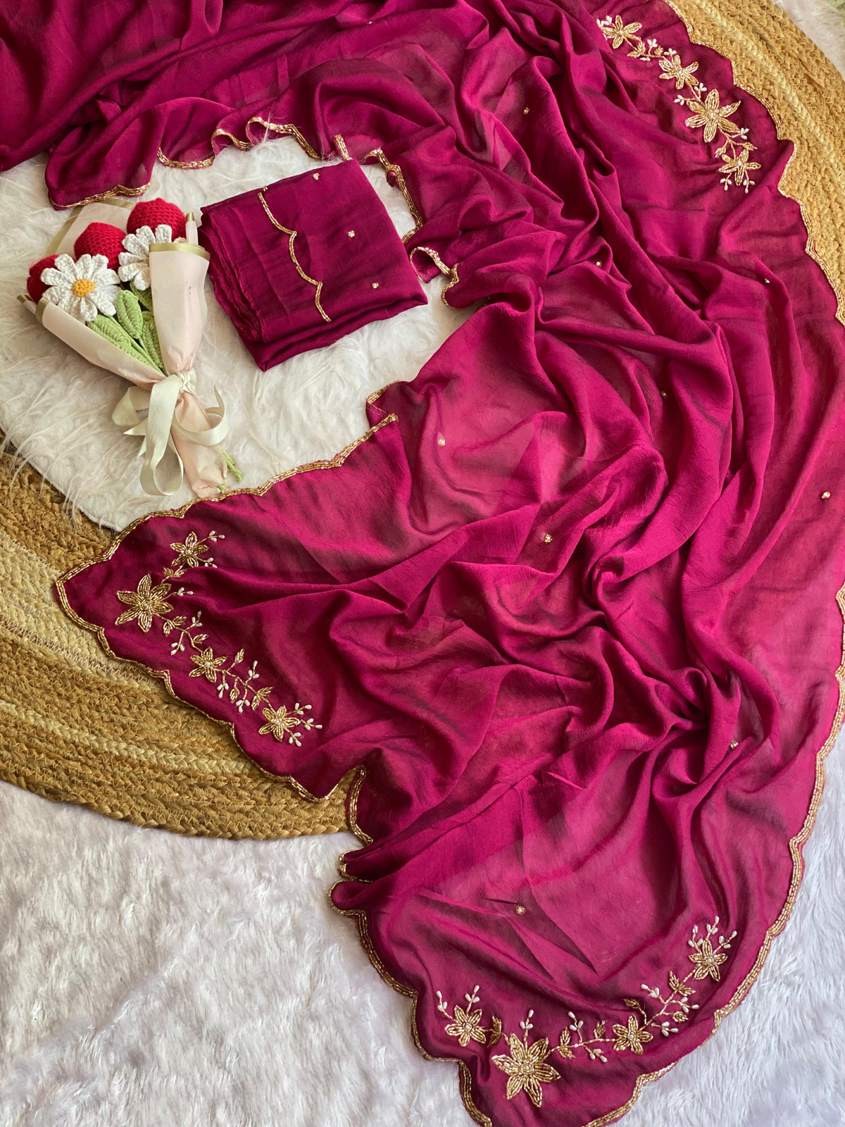 Magenta crush silk saree spread out showing butta pallu, scattered bead buttis and scalloped gold bead border