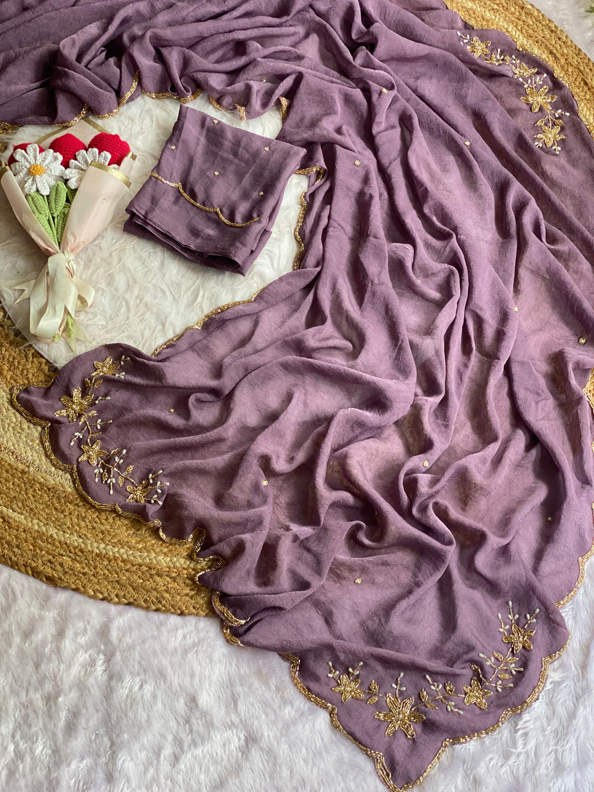 Mauve crush silk saree spread out showing butta pallu, scattered bead buttis and scalloped gold bead border