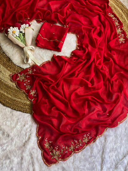 Red crush silk saree spread out showing butta pallu, scattered bead buttis and scalloped gold bead border