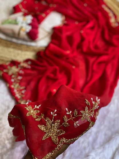 Close-up of gold tube bead and pearl drop floral handwork on Red crush silk saree with scalloped bead edge