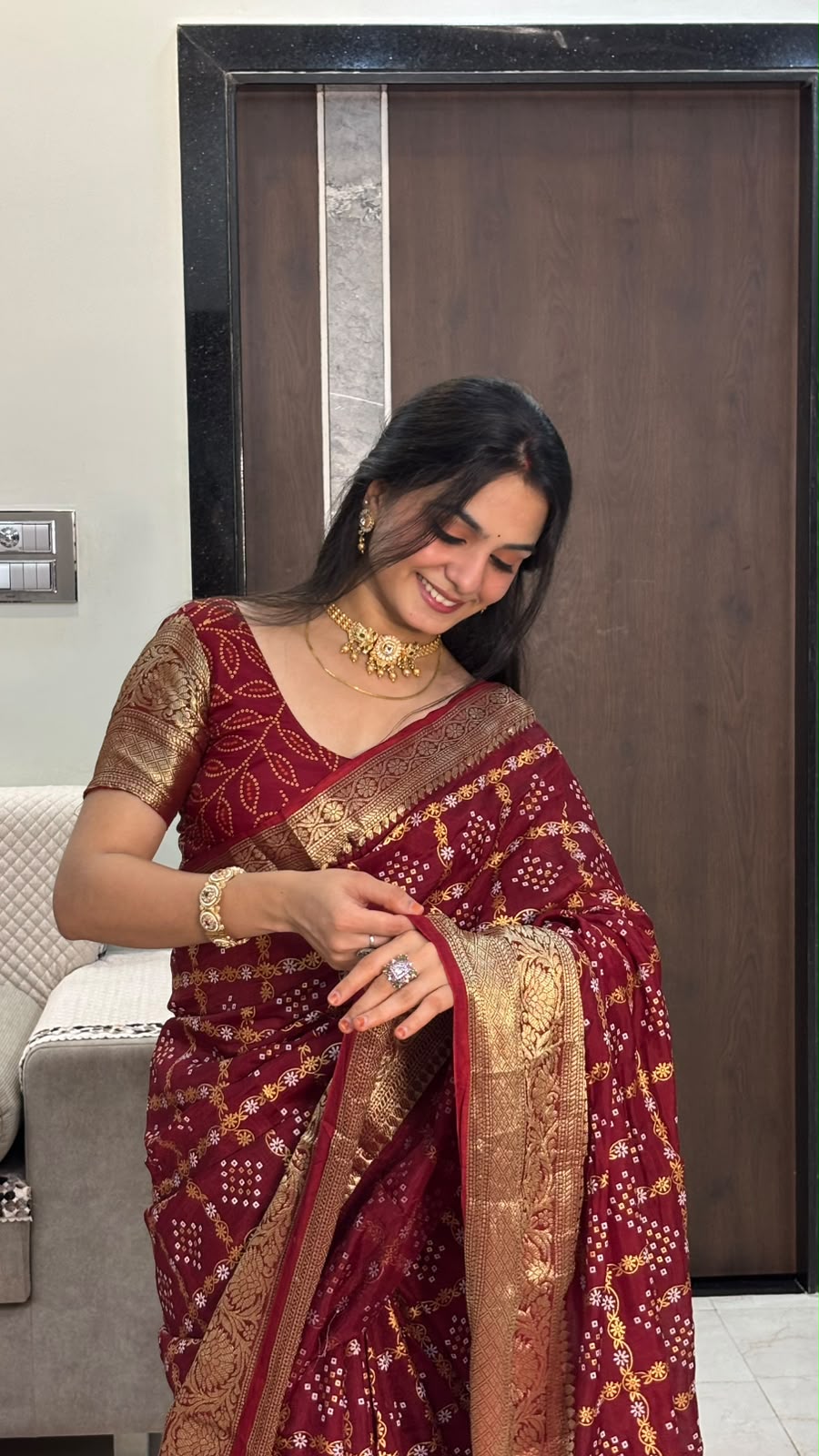 Maroon bandhani saree zari border with bandhani leaf-pattern blouse