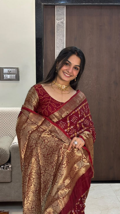 Close-up of rich gold zari pallu on maroon bandhani saree