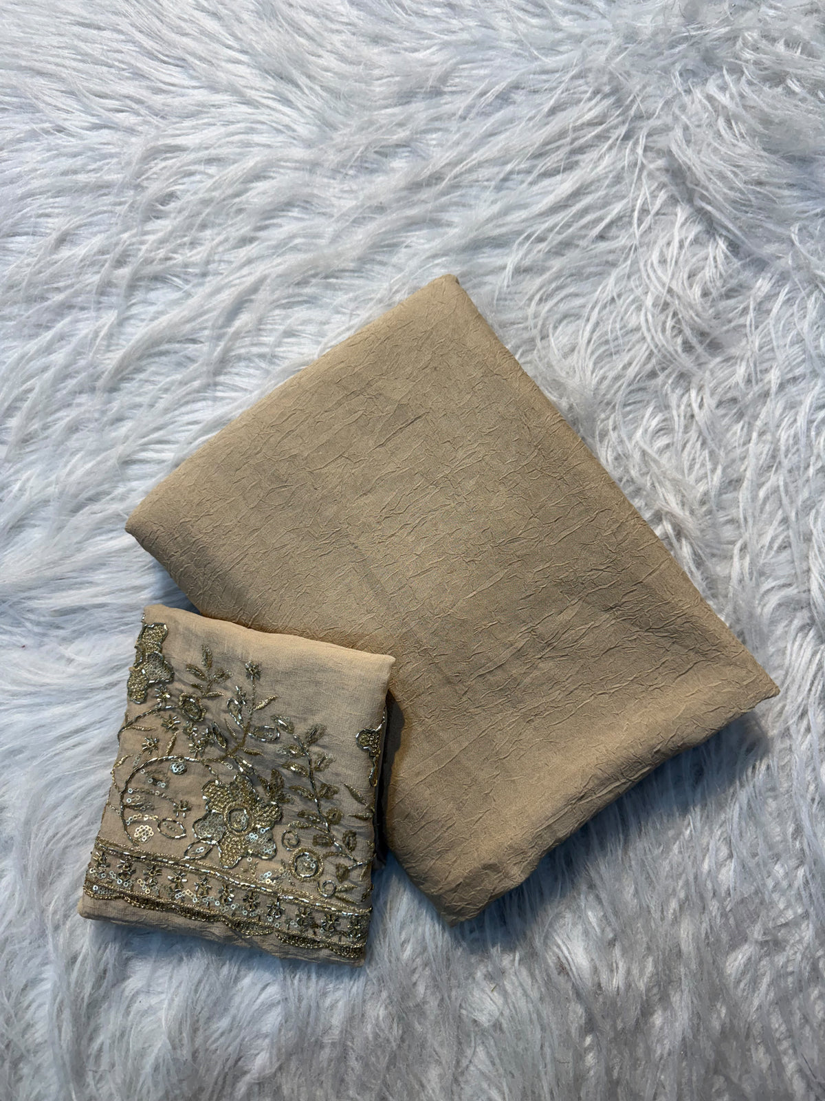 Beige plain georgette saree with sequin floral embroidered blouse and scalloped border