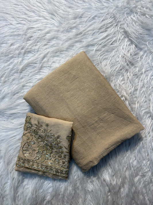 Beige plain georgette saree with sequin floral embroidered blouse and scalloped border