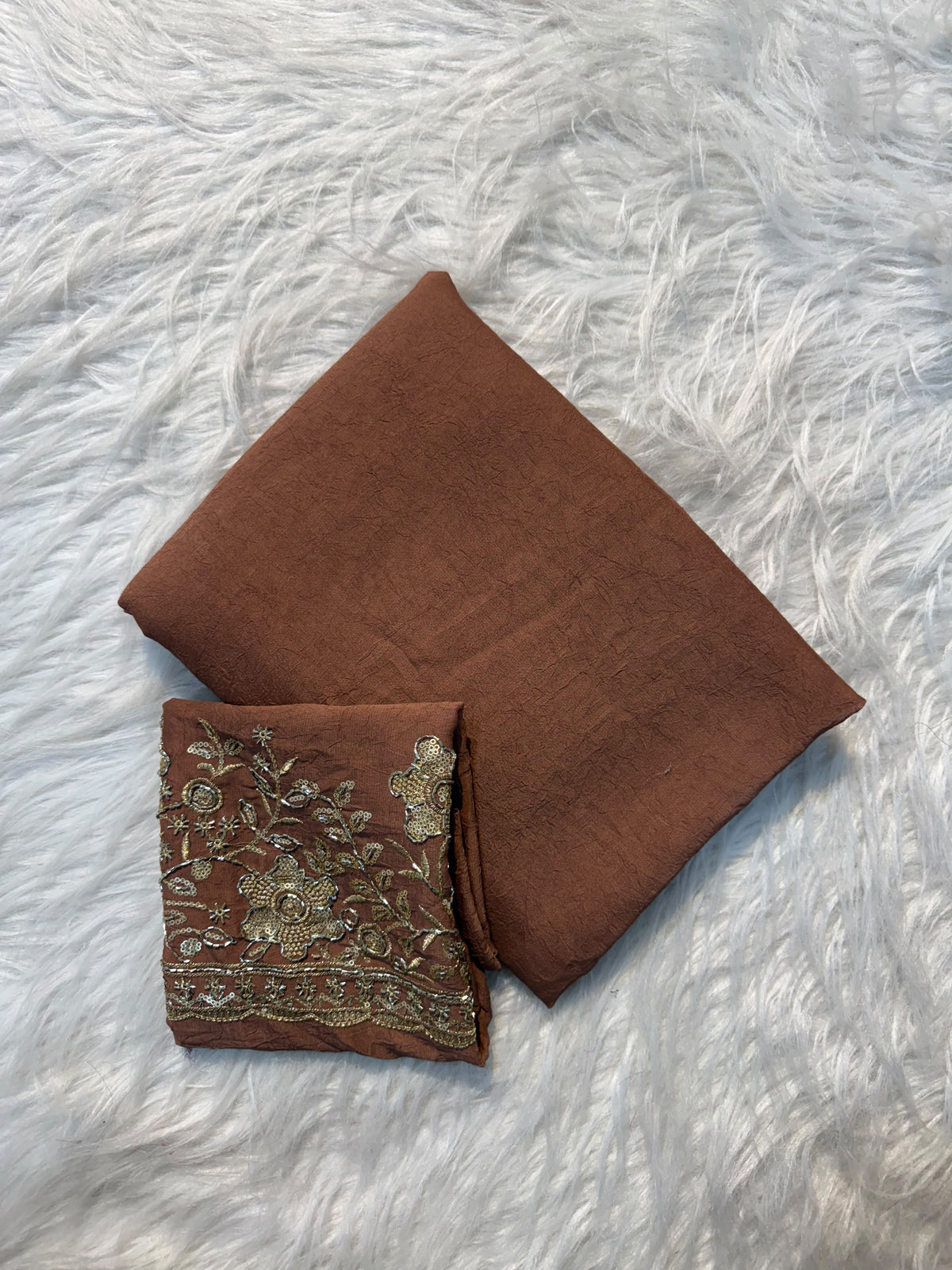 Brown plain georgette saree with sequin floral embroidered blouse and scalloped border