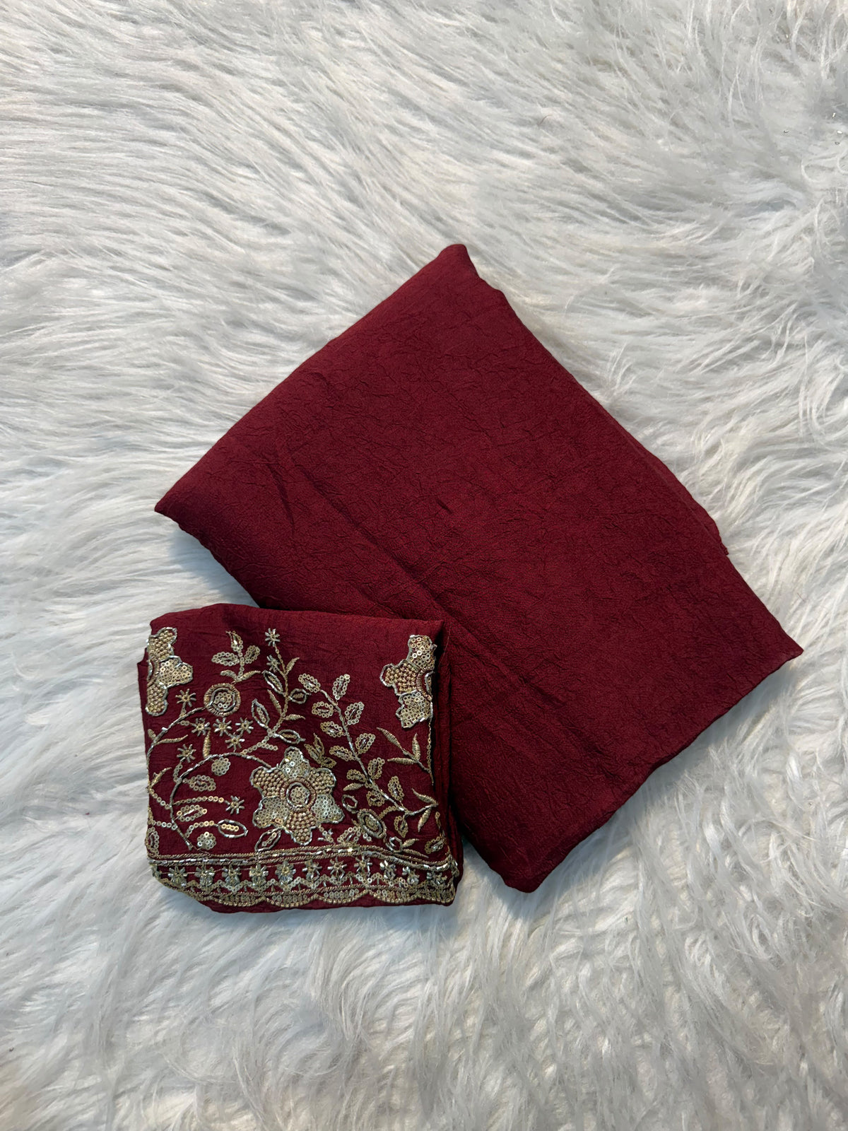 Maroon plain georgette saree with sequin floral embroidered blouse and scalloped border