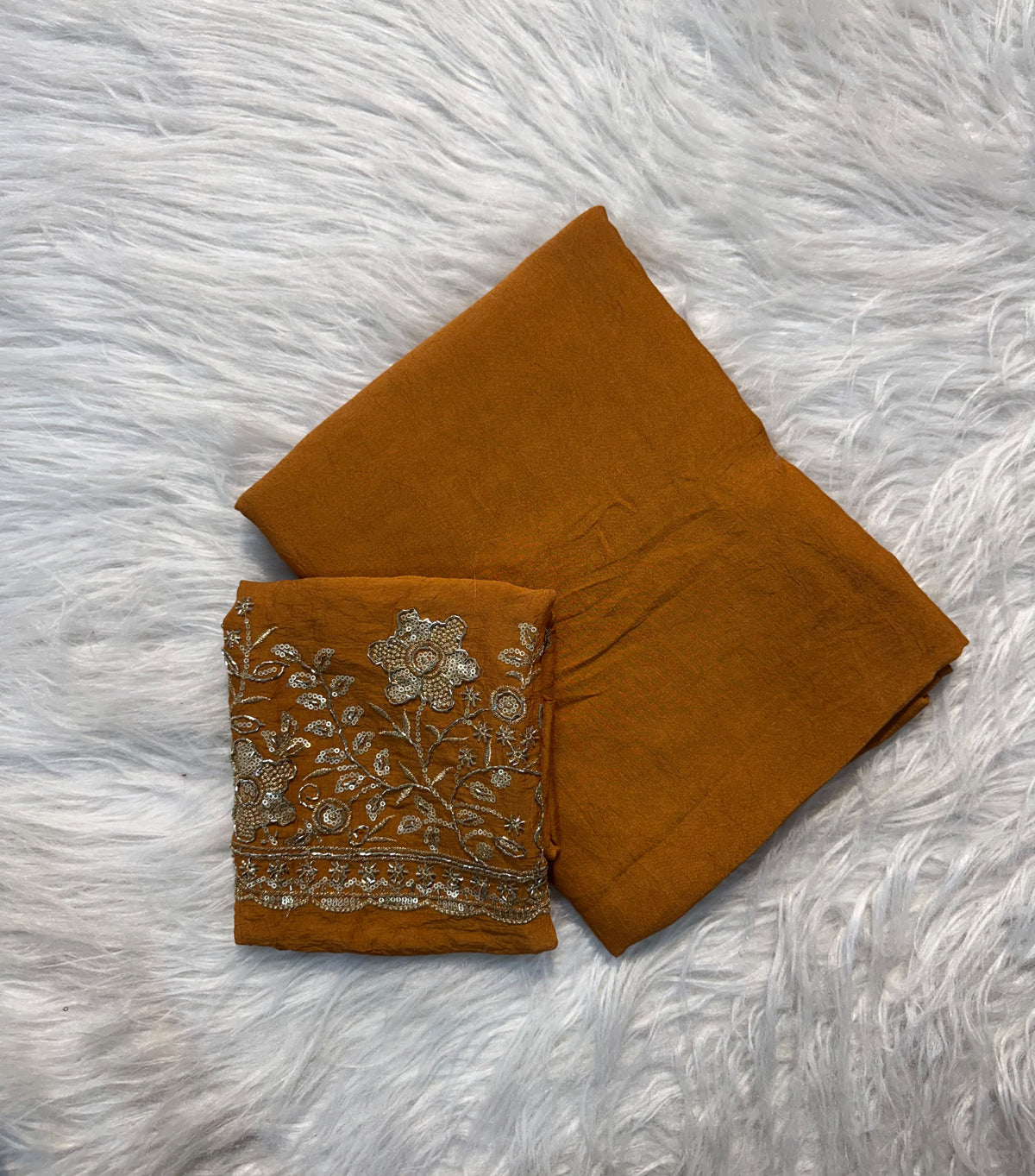 Mustard plain georgette saree with sequin floral embroidered blouse and scalloped border