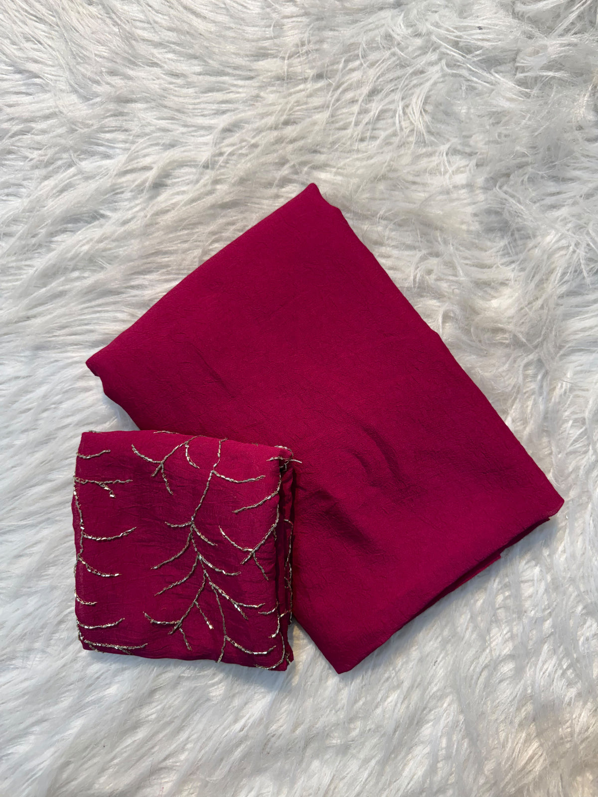 Rani pink plain Rangoli viscose georgette saree with embroidered blouse featuring metallic branch motif