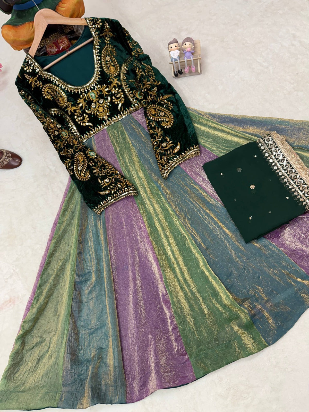 Multicolour Fendy silk flair panels in green, purple and teal with folded bottle green dupatta