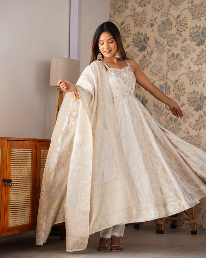 Model in ivory Banarasi jacquard dola silk Anarkali gown with gold floral weave and long dupatta