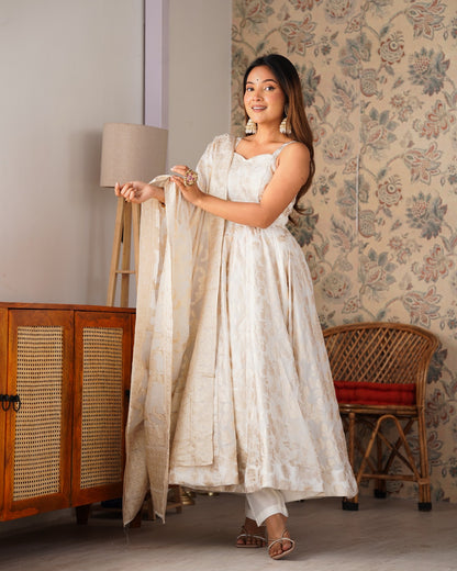 Ivory sleeveless Anarkali gown set with pant and dupatta held in front