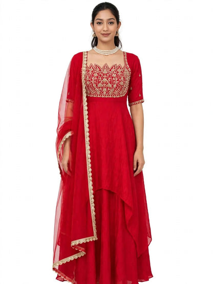 Front view of red Anarkali gown set with gold lotus yoke, high-low layered hem and net dupatta