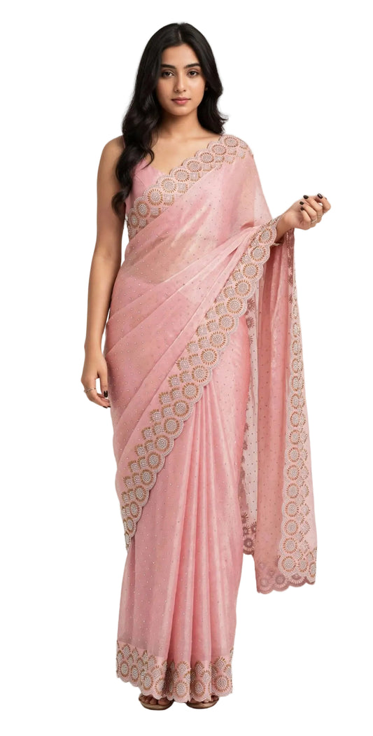Model wearing a pink space silk saree with stone work, front view showing the scalloped stone and bead border on the pleats and pallu