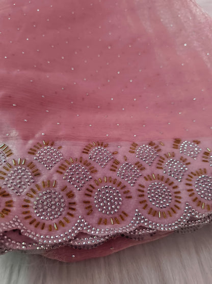 Close-up of the scalloped border with round stone medallions and gold-tone bugle beads on pink space silk