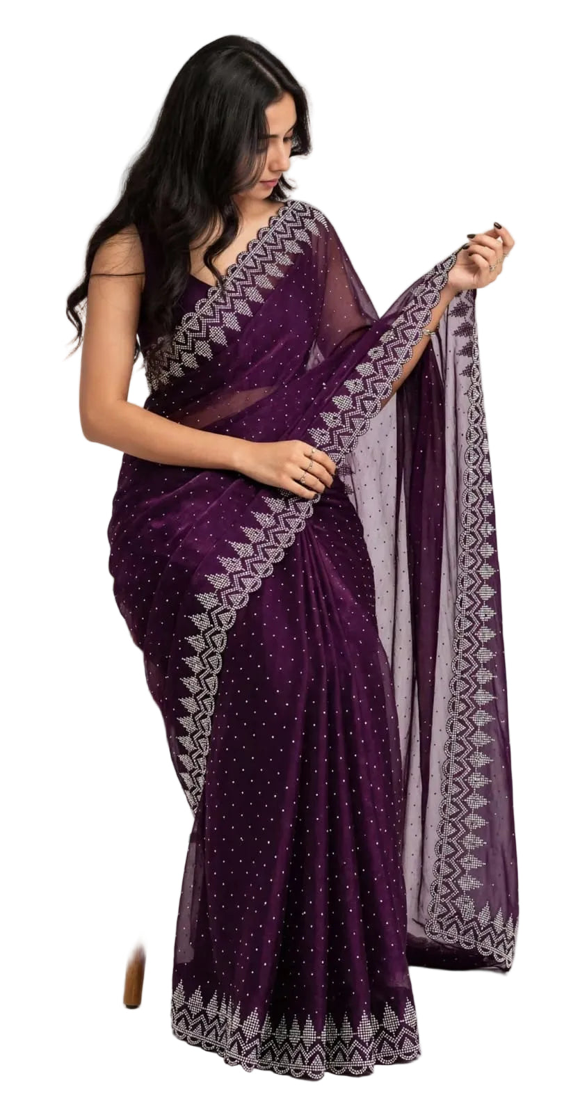 Seated model holding out the purple georgette pallu, showing geometric stone motifs along the border