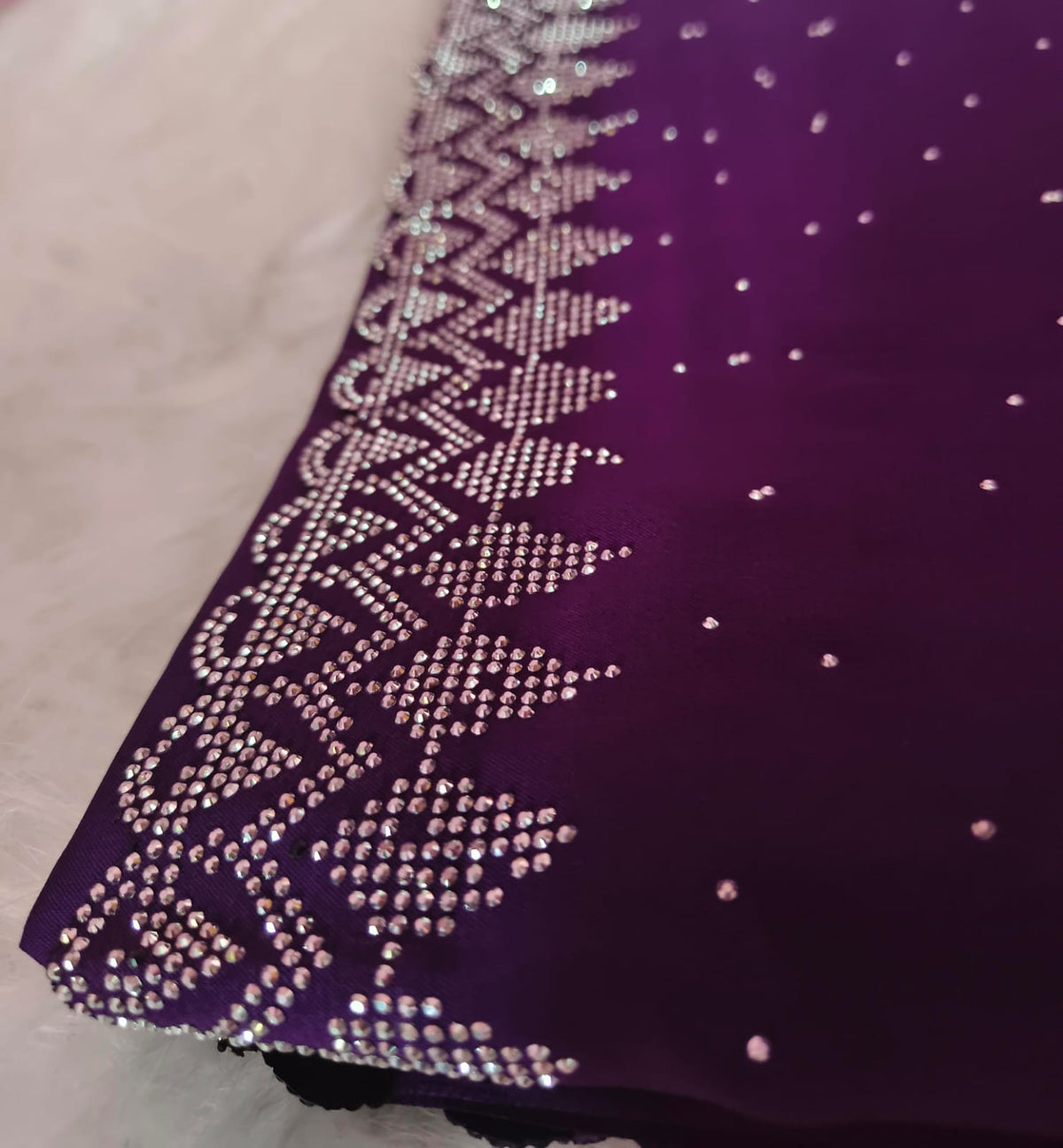 Close-up of the silver-tone geometric stone border on purple georgette with scattered stone dots