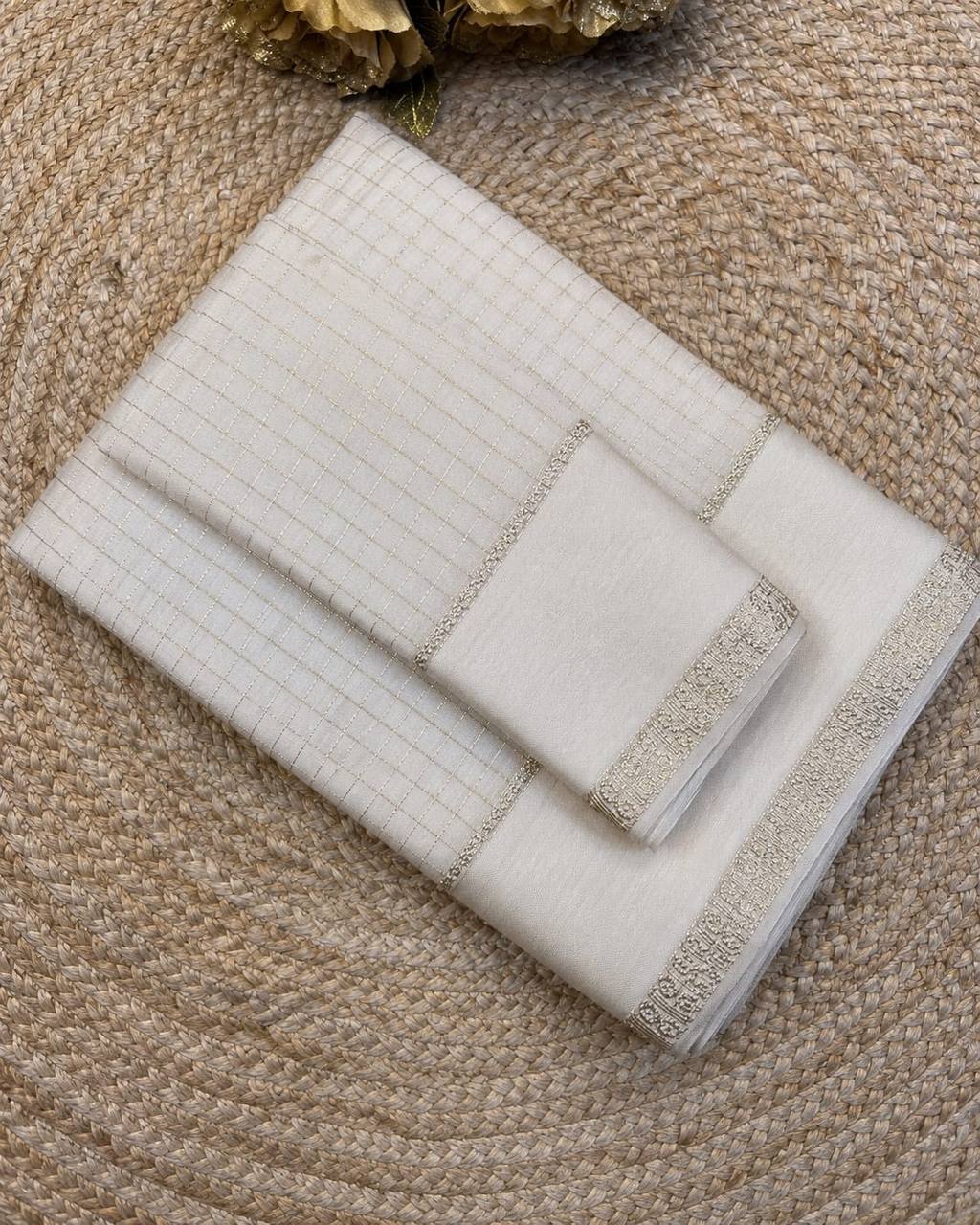 Set of white with decorative trim on a textured surface