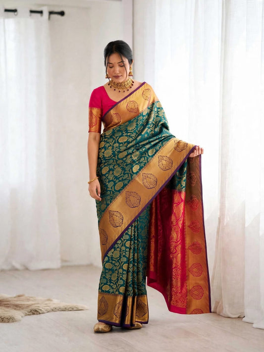 Woman wearing teal Kanjeevaram soft silk saree with pink blouse and zari border